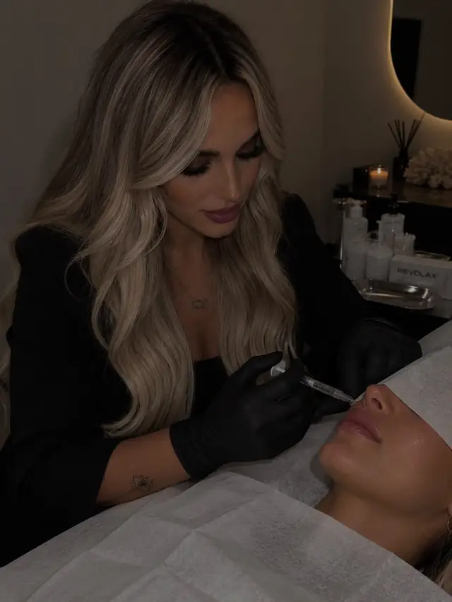 Chloe Abbott, founder of Seren Haus, performing a lip filler treatment
